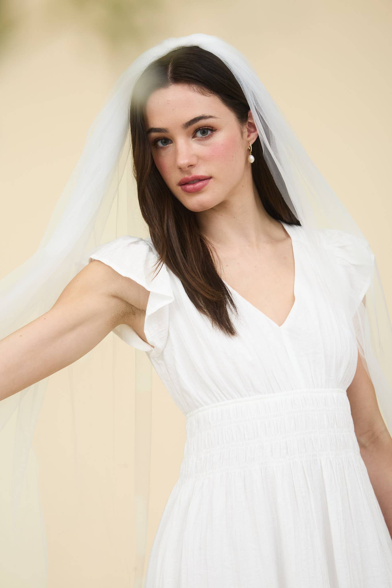 Elegant ruffle sleeve mini dress featuring a V neckline and shirred elastic waist, perfect for special occasions.