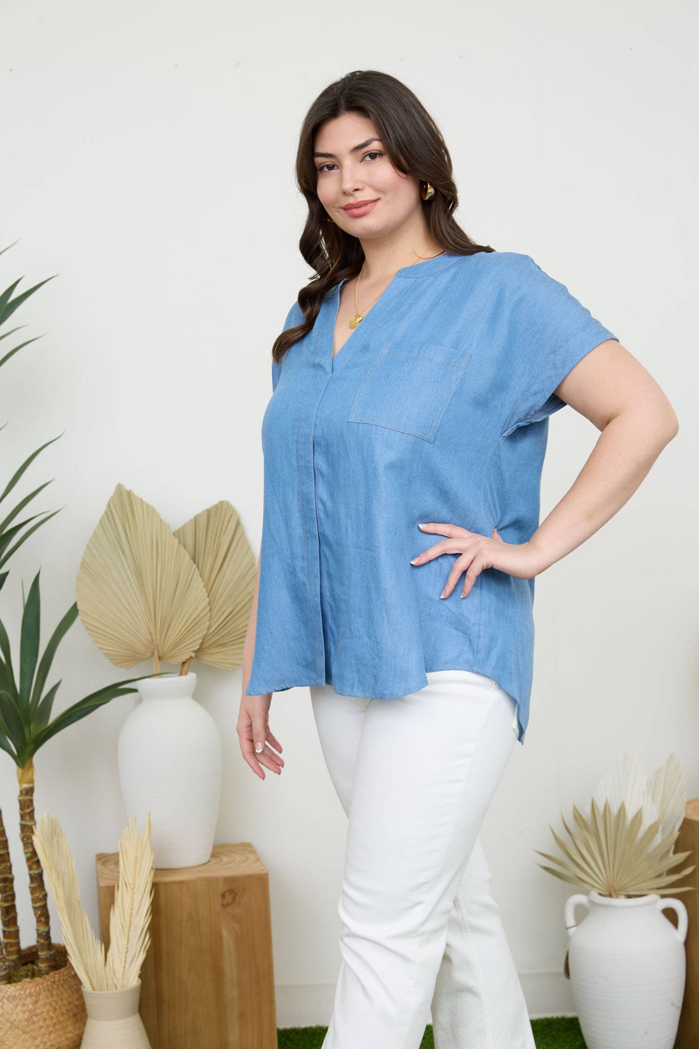 Stylish PLUS BACK BUTTON CUFF SLEEVE CHAMBRAY TOP featuring a split neckline and pocket detail for easy versatility.