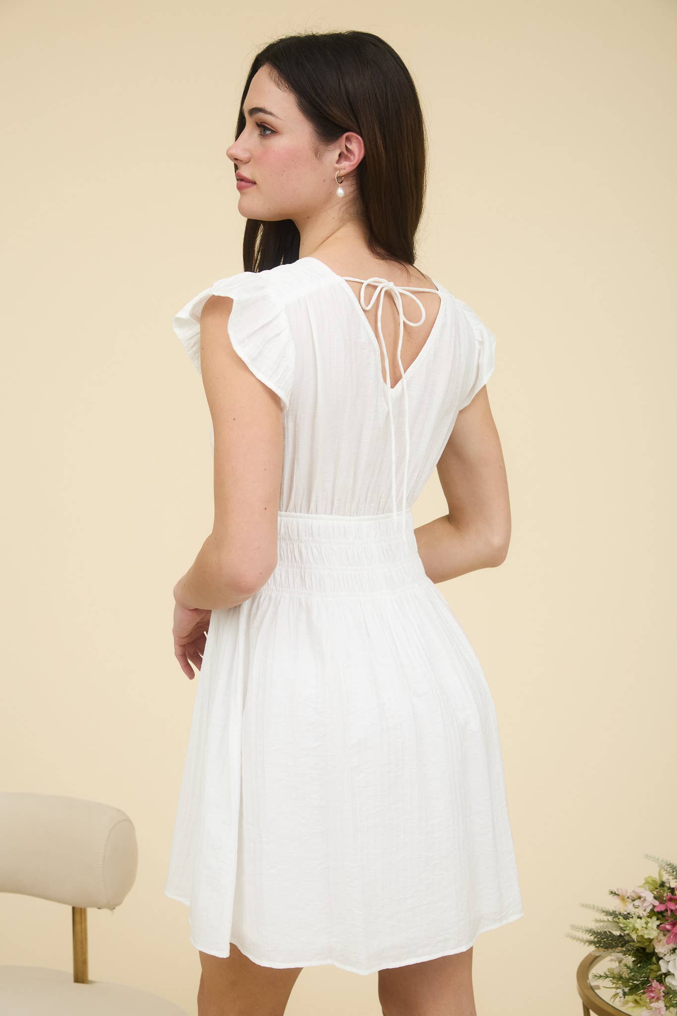 Stylish RUFFLE SLEEVE MINI DRESS featuring a V neckline and shirred elastic waist, perfect for any occasion.