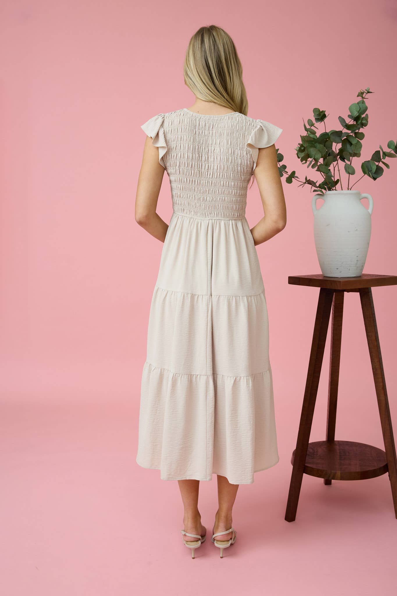 Elegant FLUTTER SLEEVE MAXI DRESS featuring a smocked bodice and tiered design, perfect for any occasion.