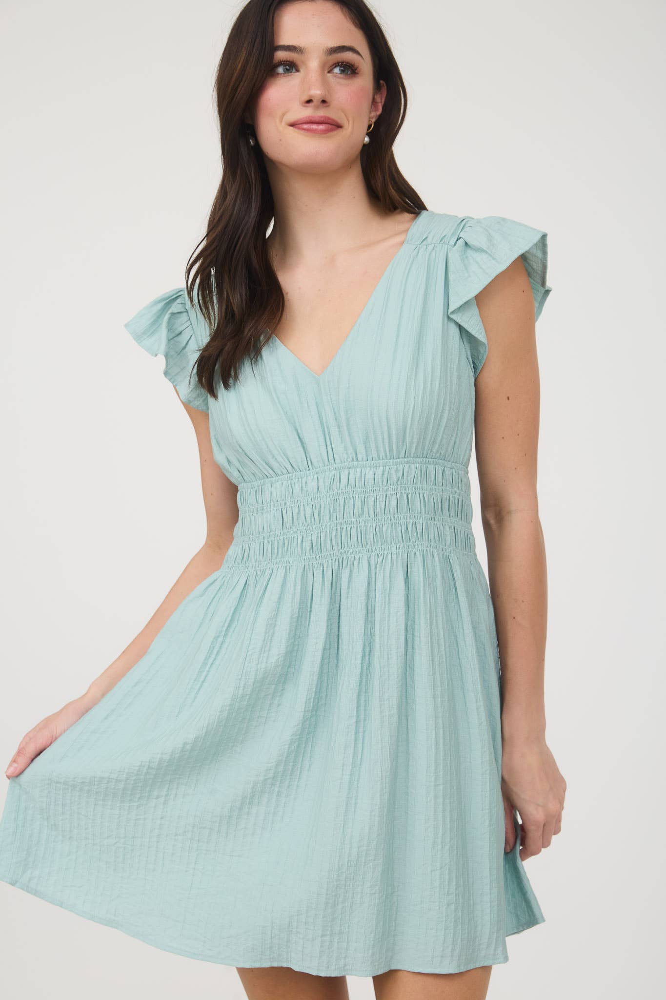 Stylish RUFFLE SLEEVE MINI DRESS featuring a V neckline, shirred elastic waist, and lightweight fabric perfect for summer.