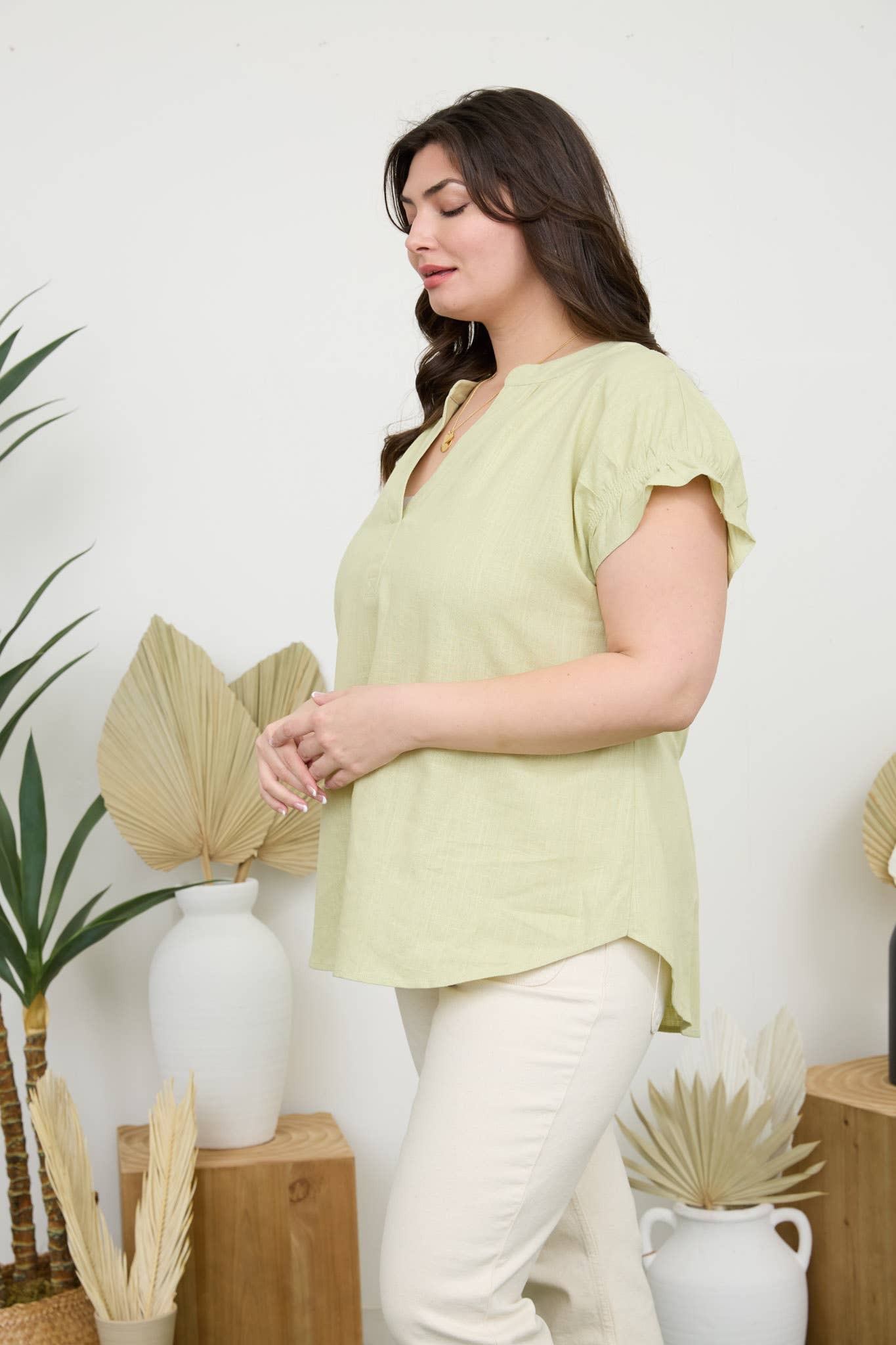 Stylish Curvy Ruched Sleeve Linen Blouse in light green, featuring ruched sleeves and a split neckline. Perfect for warm days.