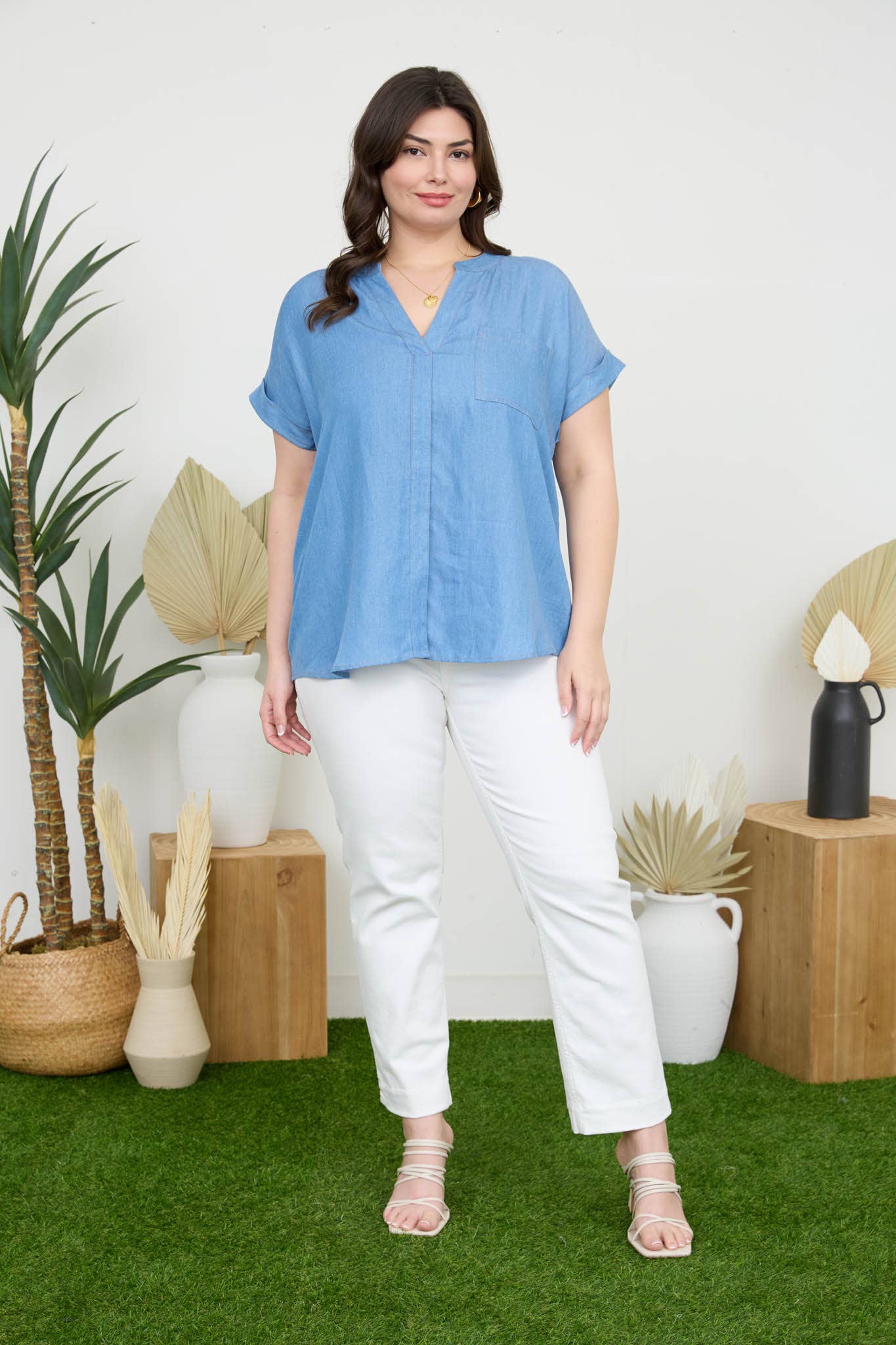 Stylish PLUS BACK BUTTON CUFF SLEEVE CHAMBRAY TOP featuring a split neckline and pocket detail, perfect for casual wear.