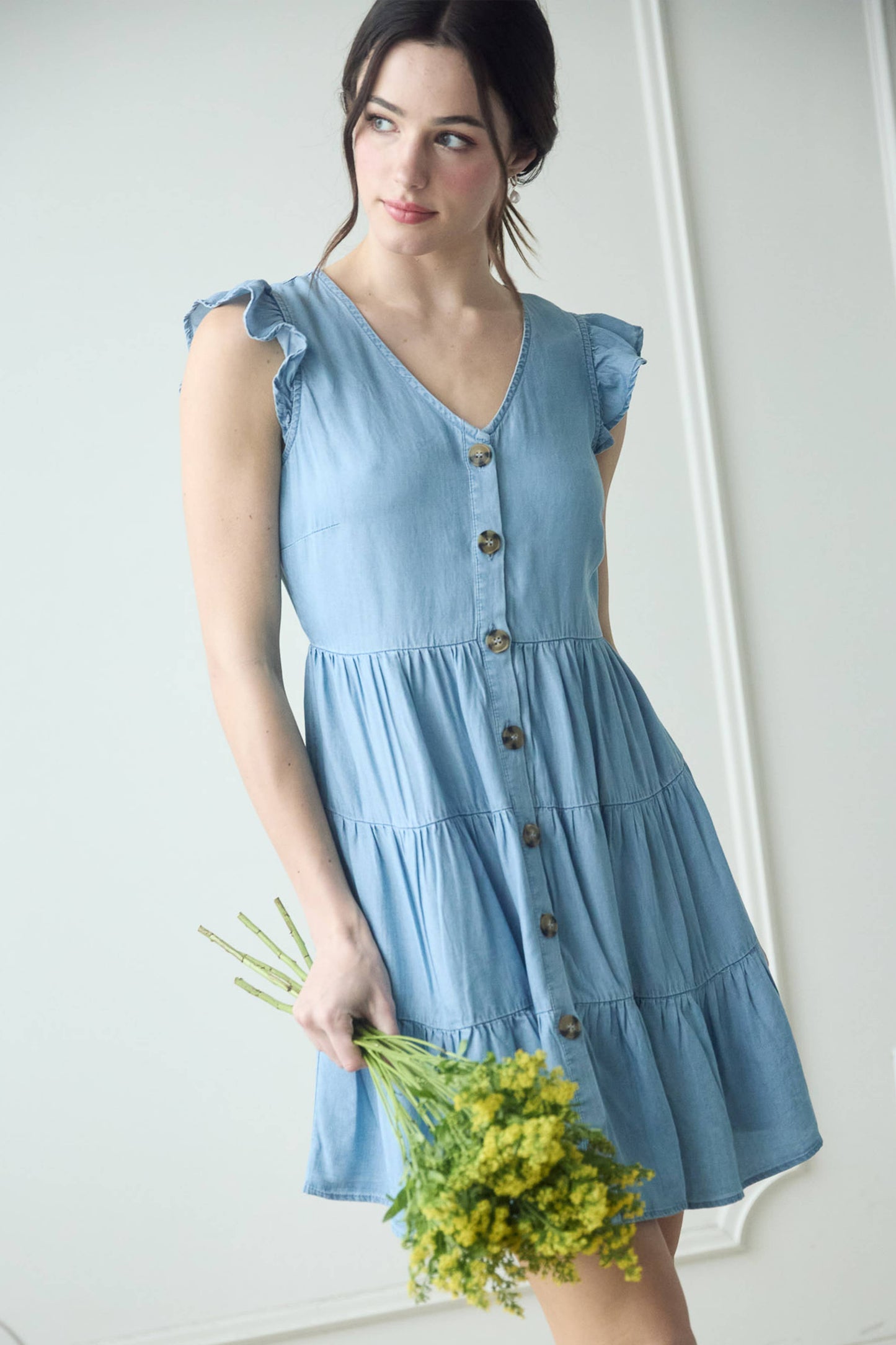 Stylish CHAMBRAY BUTTON DOWN TIERED MINI DRESS with flutter sleeves and tortoise buttons, perfect for any occasion.