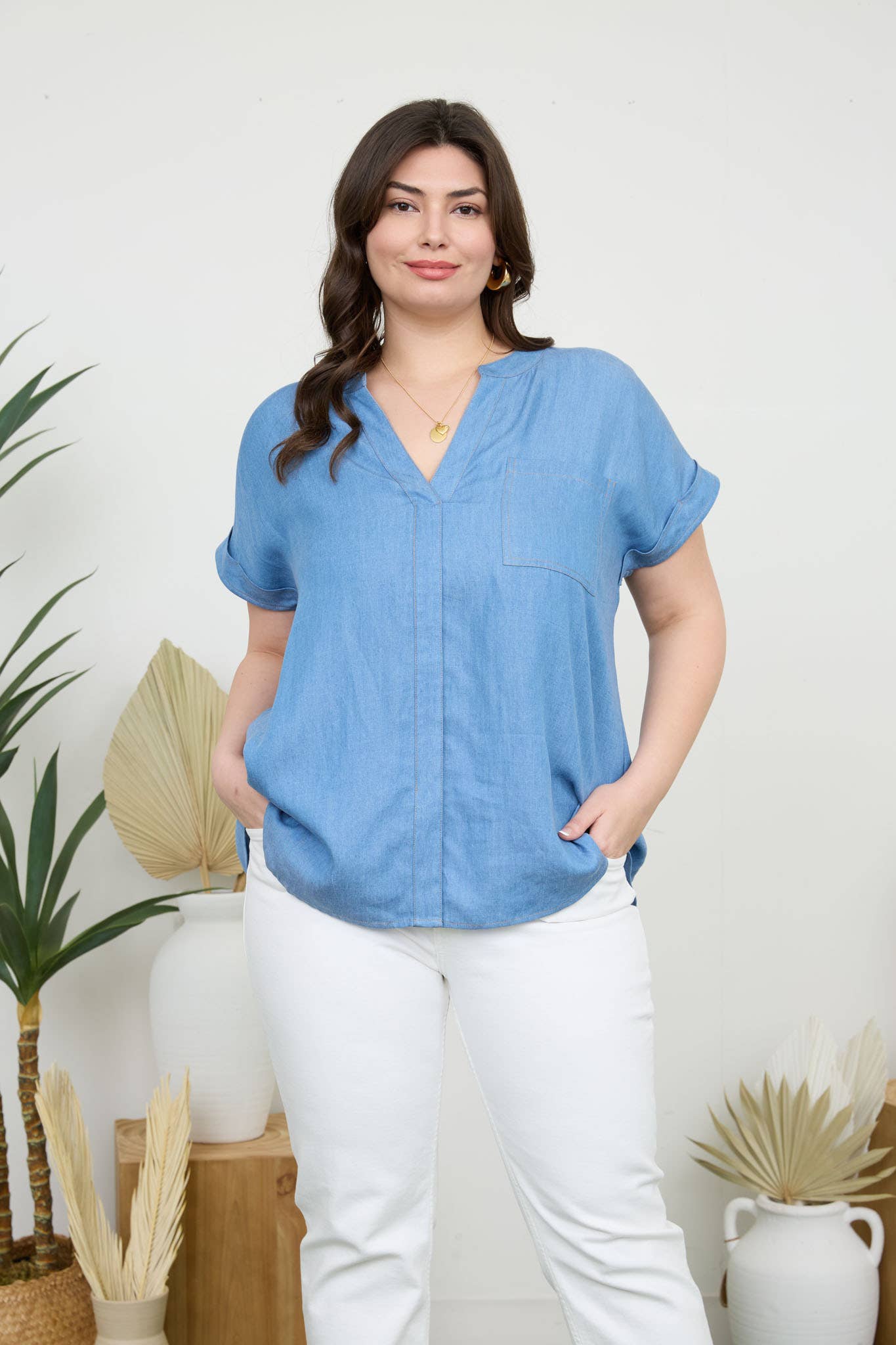 Chic PLUS BACK BUTTON CUFF SLEEVE CHAMBRAY TOP with split neckline and pocket detail, perfect for casual style.