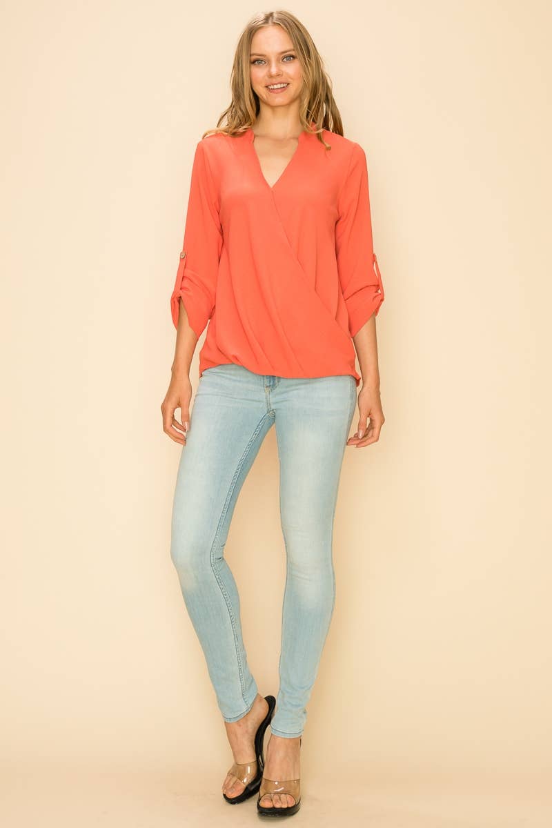 Stylish WRAP COLLAR BLOUSE with a faux wrap front and asymmetrical hem, perfect for a sophisticated look.