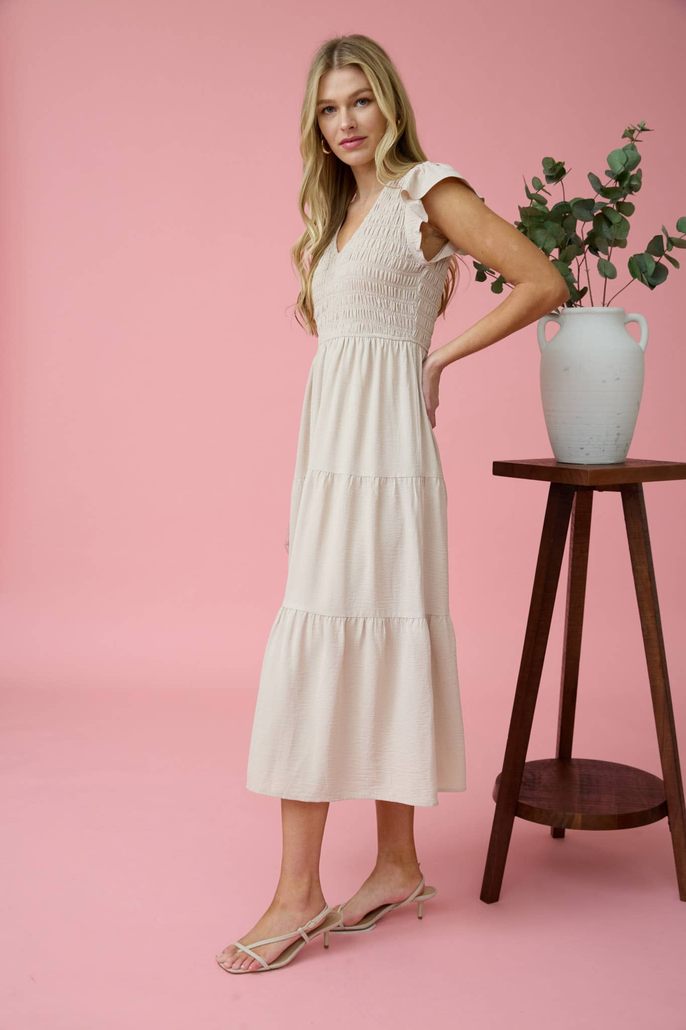 Stylish FLUTTER SLEEVE MAXI DRESS featuring a smocked bodice and tiered skirt, perfect for elegant occasions.