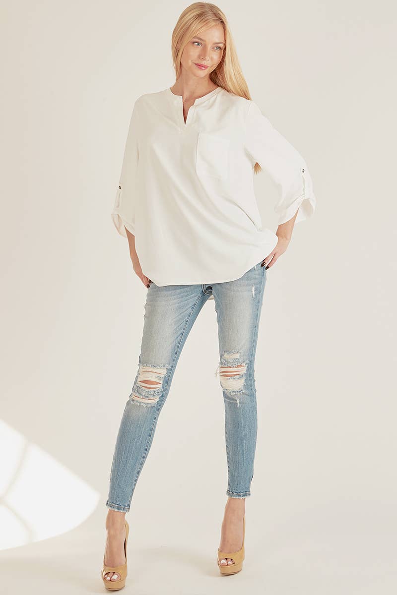 Stylish Pocket Blouse in white, featuring a front pocket and loose fit, perfect for versatile everyday wear.