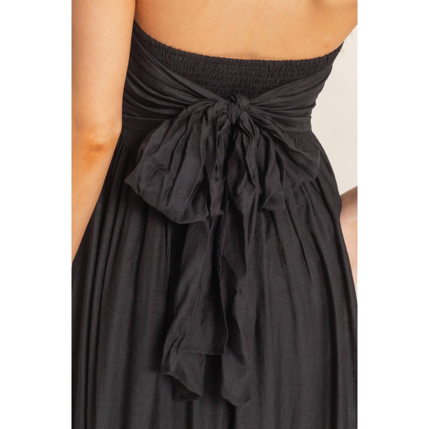 Strapless tie-back smocked dress with back sash and flowing silhouette
