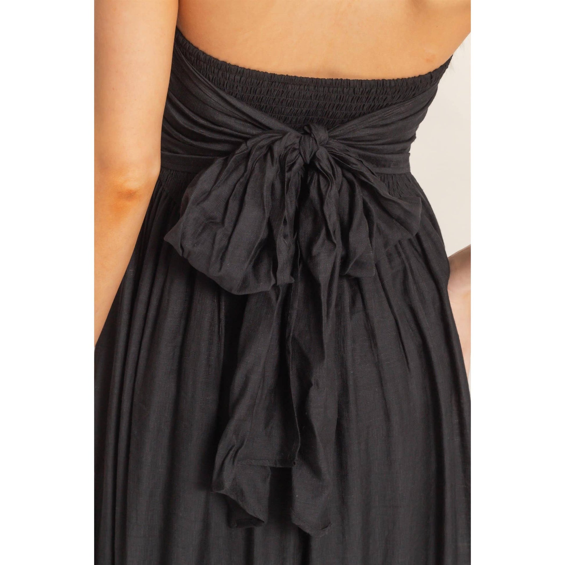 Strapless tie-back smocked dress with back sash and flowing silhouette