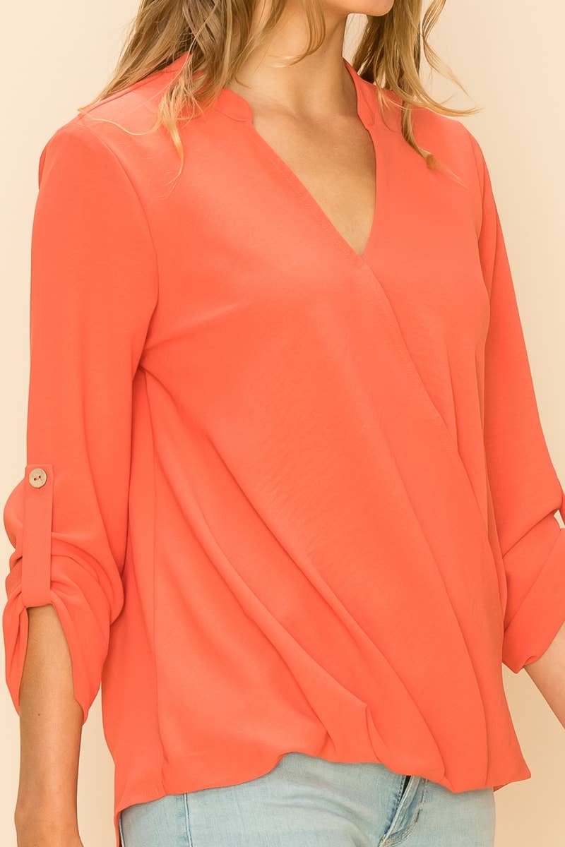 Stylish WRAP COLLAR BLOUSE with V-neck, long sleeves, and asymmetrical hem for a chic look at [store name].