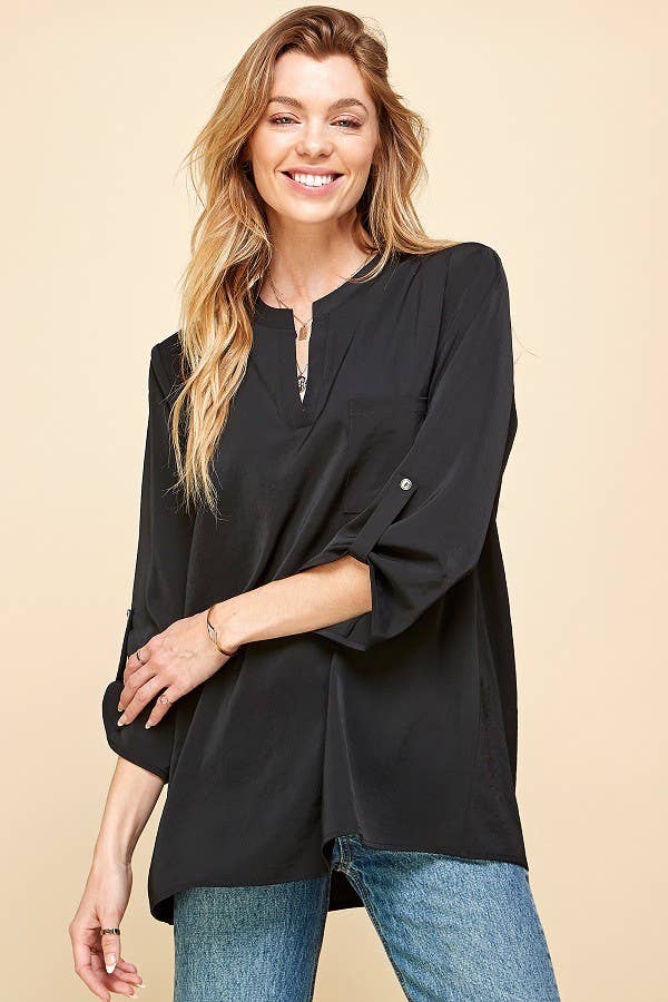 Stylish Pocket Blouse featuring a front pocket and loose fit, perfect for versatile and comfortable wear.