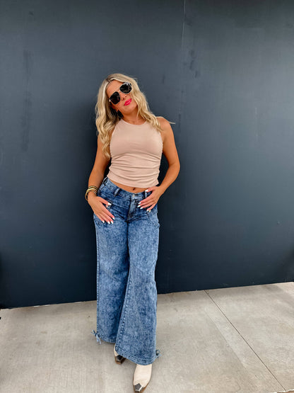 Blakeley models Charlie Cinch Hem Wide Leg Jeans in blue denim with elastic waist and cinch hem.