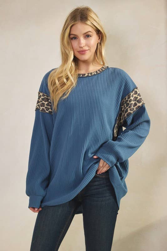 Blue Animal Contrast Top with leopard-print sleeve panels, ribbed knit, long sleeves, round neck.