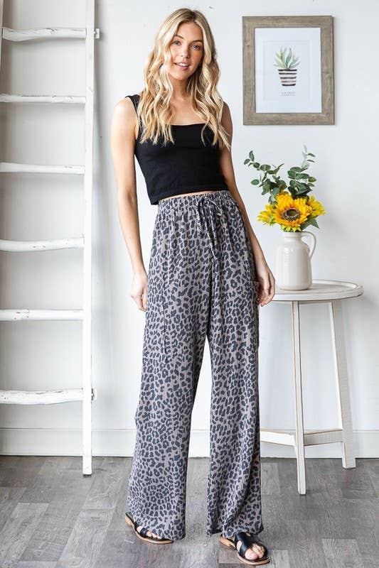 Wild Side Pants, animal print, 95% polyester 5% spandex, elastic waistband, side pockets, drawstring, wide-leg pants.