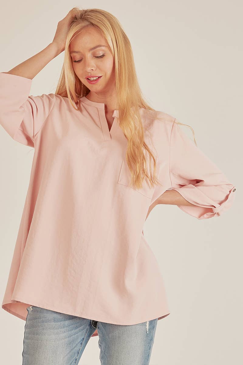Stylish Pocket Blouse in soft pink, featuring a front pocket and loose fit, perfect for any occasion at your favorite store.