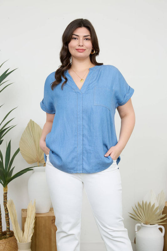 Chic PLUS BACK BUTTON CUFF SLEEVE CHAMBRAY TOP with split neckline and pocket detail, perfect for casual style.