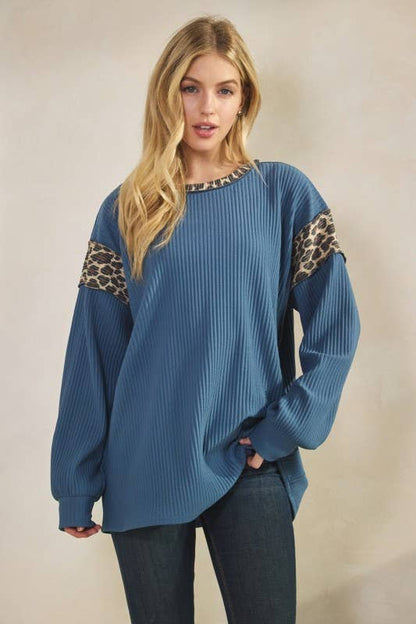 Animal Contrast Top, polyester-spandex blend, blue rib-knit long-sleeve round-neck with leopard print sleeve panels.