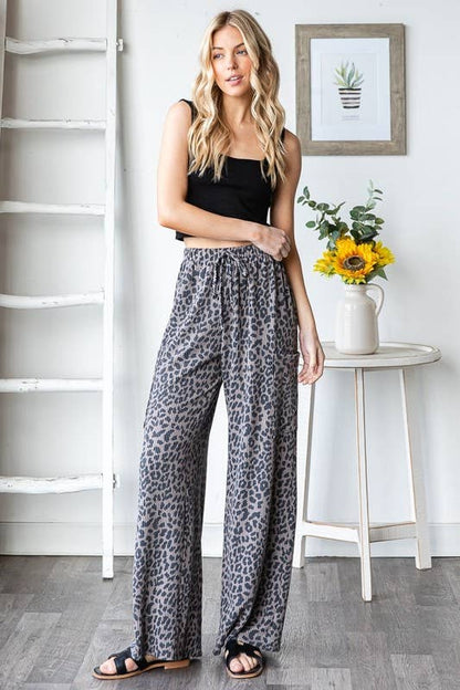 Wild Side Pants: leopard animal print, polyester-spandex, elastic waistband with drawstring and side pockets, wide-leg