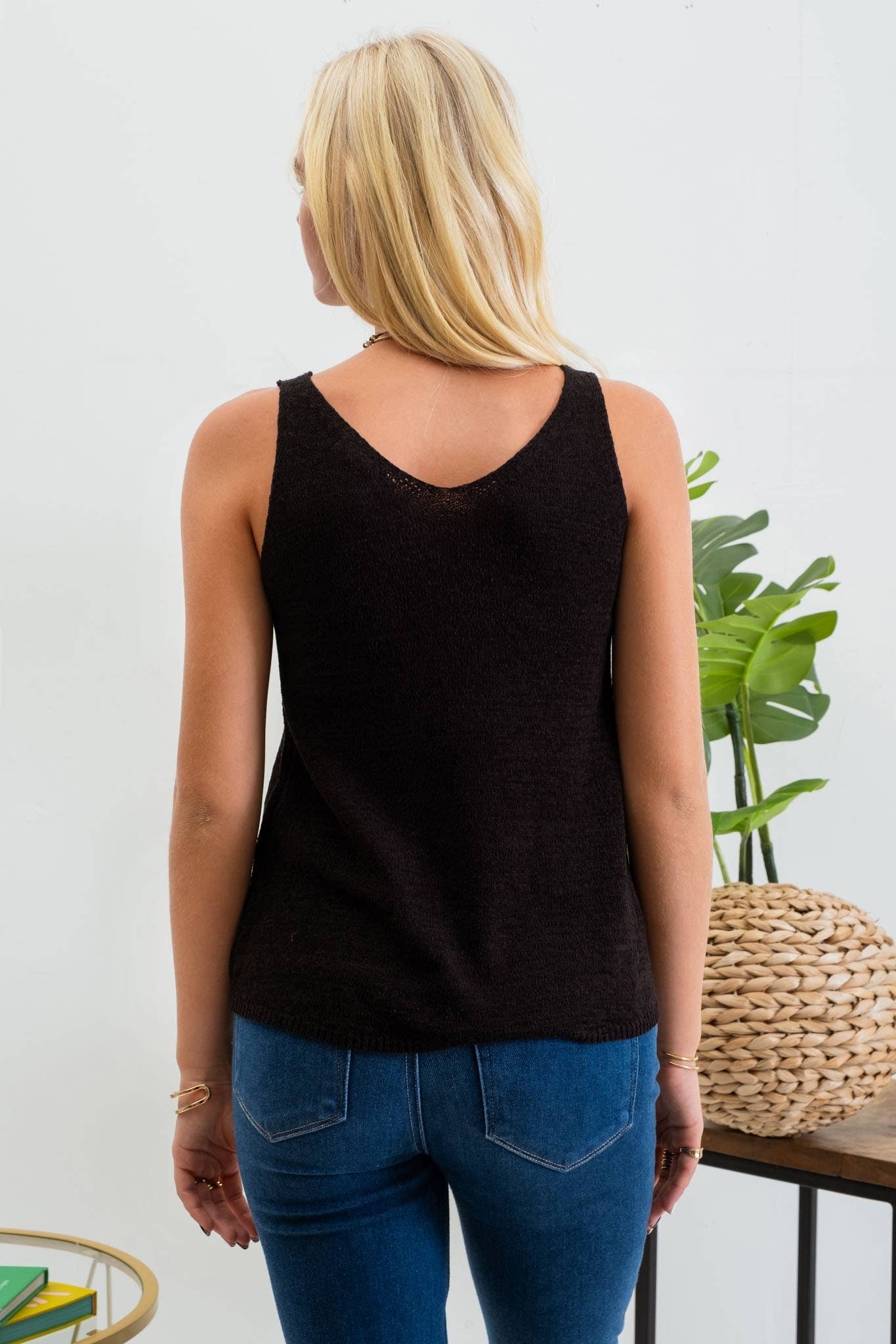 Solid black Knit Tank Top with scoop neckline, sleeveless design, and lightweight knit fabric from ShopName.
