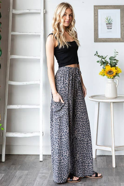 Wild Side Pants in leopard print, elastic waist with drawstring and side pockets, model wearing size small.