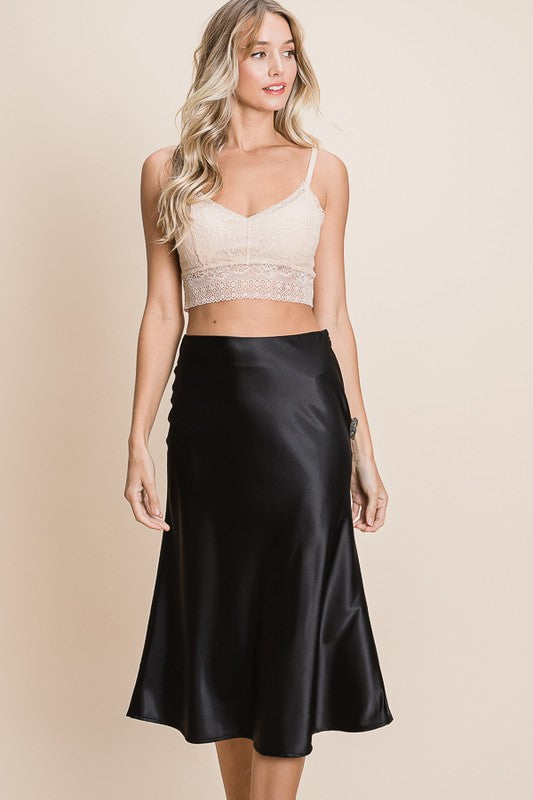 Chic Satin Midi Skirt in black, perfect for versatile styling. Elevate your wardrobe with this elegant piece.