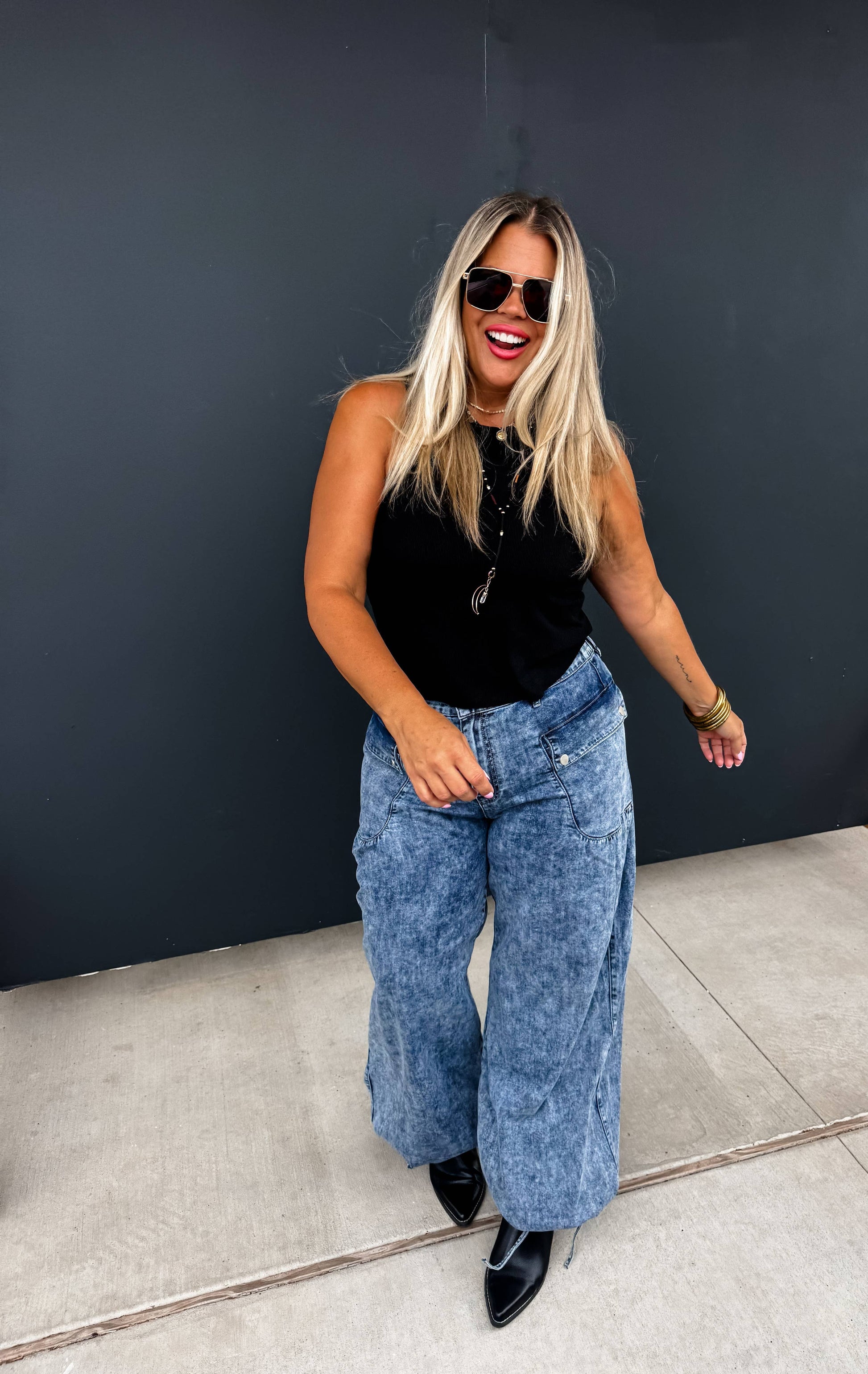 Charlie Cinch Hem Wide Leg Jeans worn by a woman; denim two-in-one with elastic back waist and front snap pockets.
