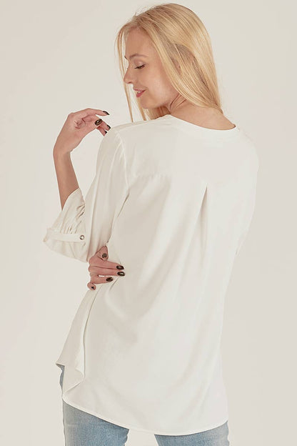 Stylish Pocket Blouse with a front pocket and loose fit, perfect for versatile everyday wear at your favorite store.
