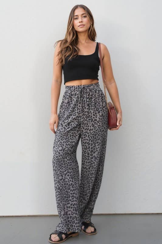 Wild Side Pants: leopard print, elastic waist with drawstring, side pockets, relaxed wide-leg pants on model