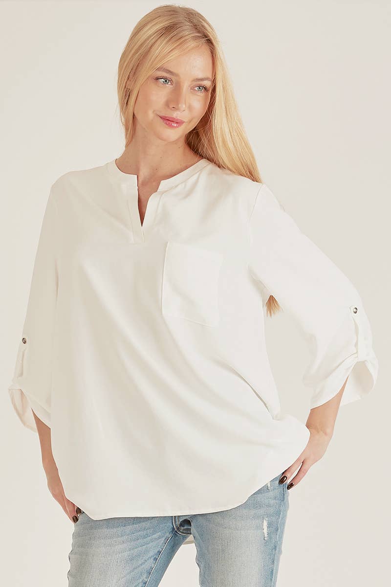 Stylish Pocket Blouse with a front pocket and loose fit, perfect for versatile, everyday wear at your favorite store.