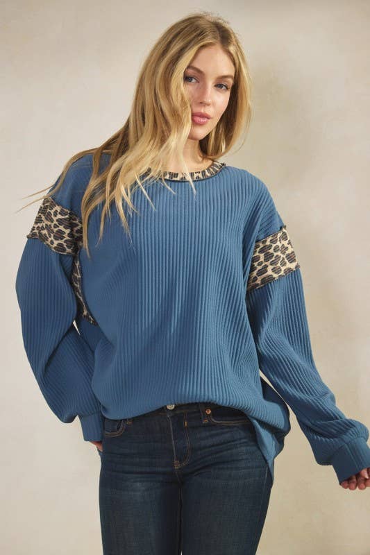 Animal Contrast Top: blue ribbed long-sleeve with leopard-print panels on sleeves and round neck.